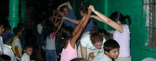 The group dances with villagers in Copapayo their second night in El Salvador.